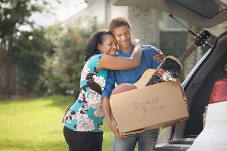 Mom hugging son, leaving for college