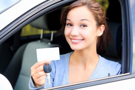 teen girl with her first driver's license