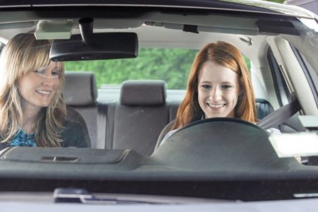 Mother and daughter driving lesson