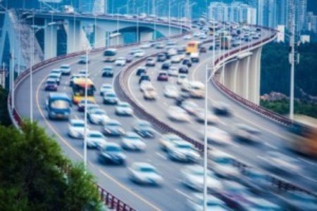 cars moving fast on the highway