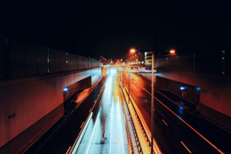 highway at night with fast headlights