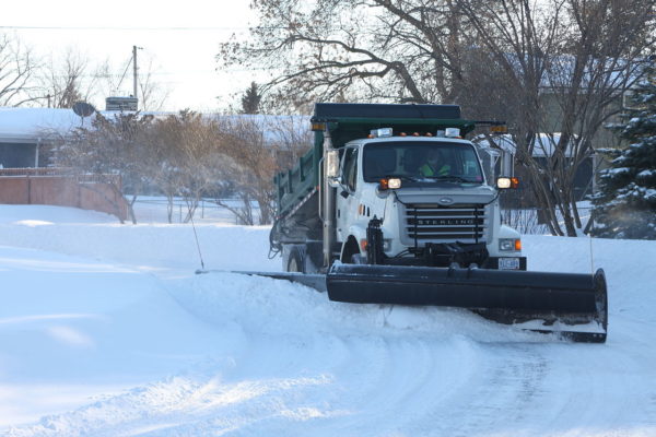 snow plow clearing the streets