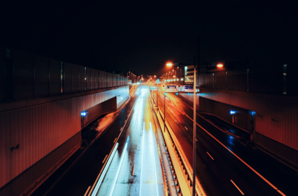 highway at night with fast headlights