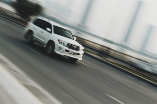 SUV speeding down the road